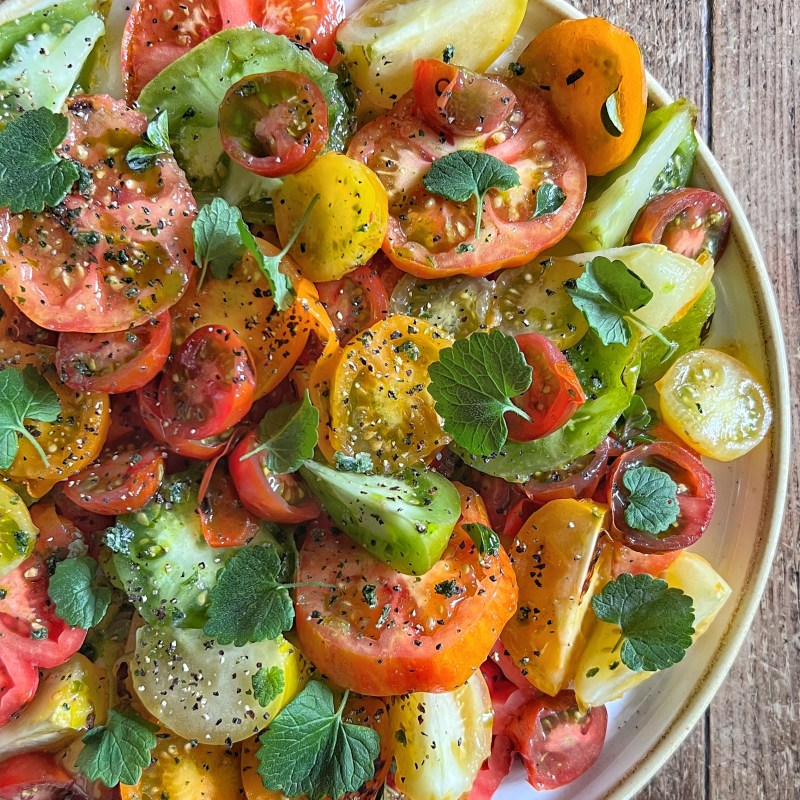 Charred Heritage Tomato Salad cooked over fire