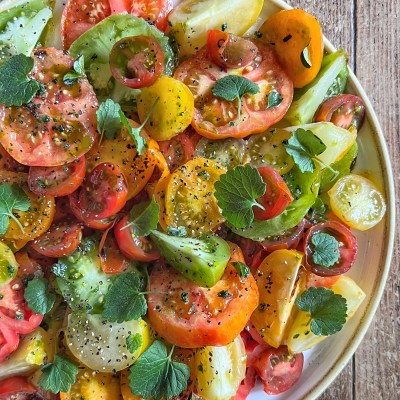 Charred Heritage Tomato Salad cooked over fire