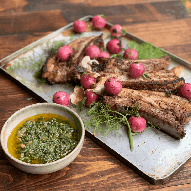 chilli, fennel and orange roast pork belly with roast radishes